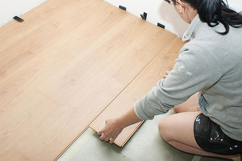 Lady installing flooring | Buckway Flooring